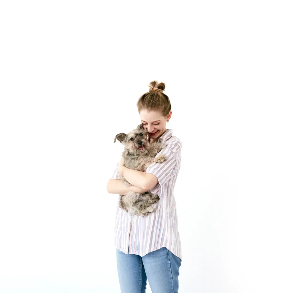 Woman caring for a small dog