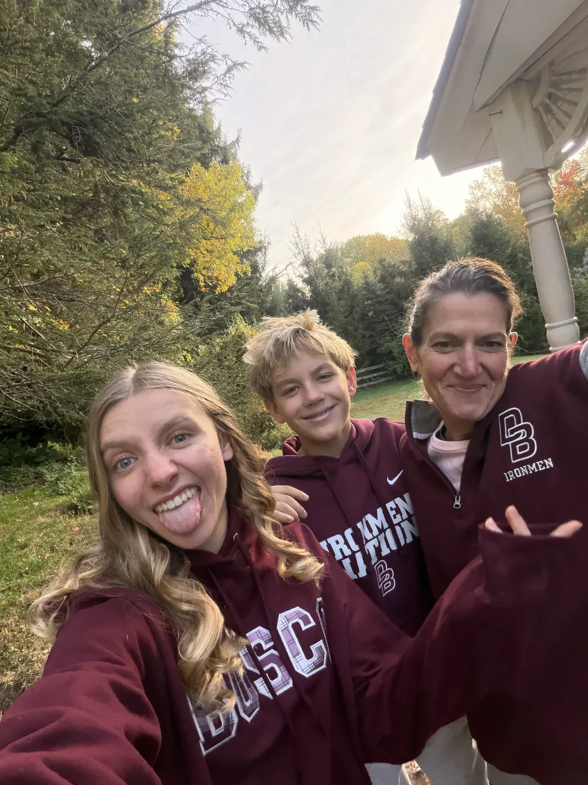 Three people posing for an outdoor selfie